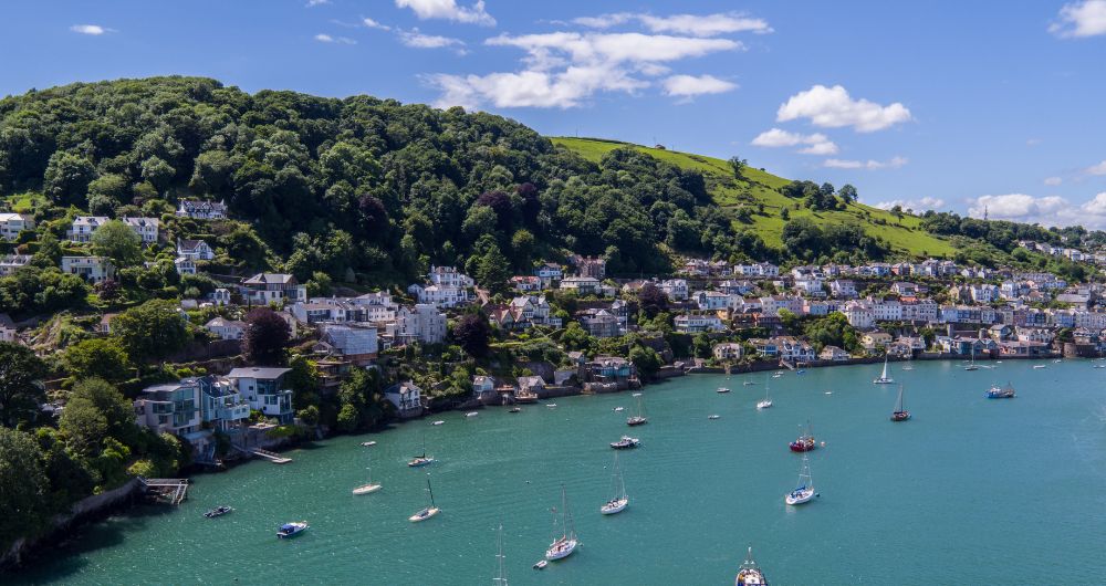 Salcombe on estuary with moored boats in South Devon